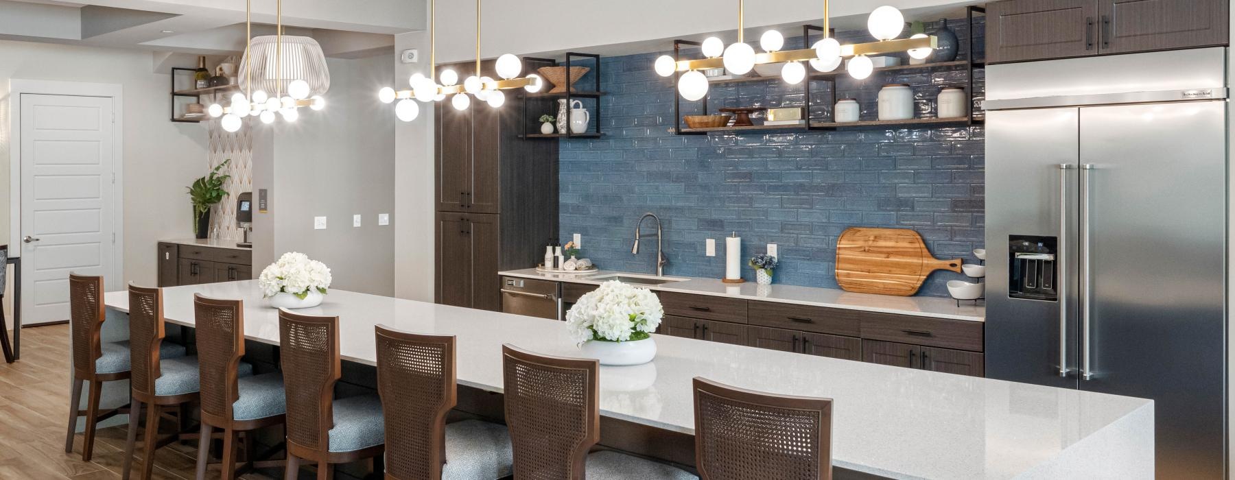 a kitchen with a dining table and chairs