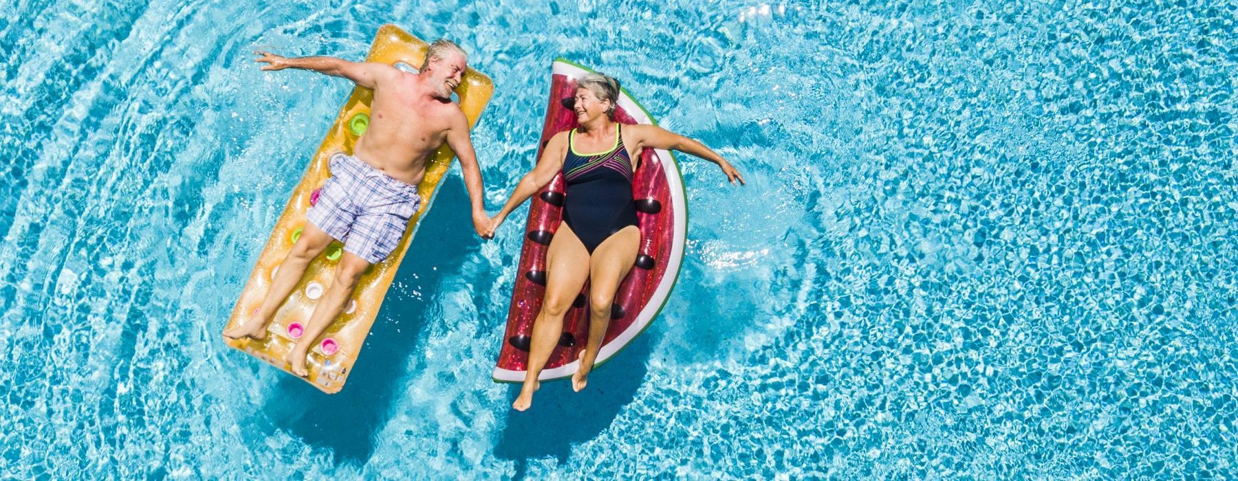 a couple of people in swimsuits in the water